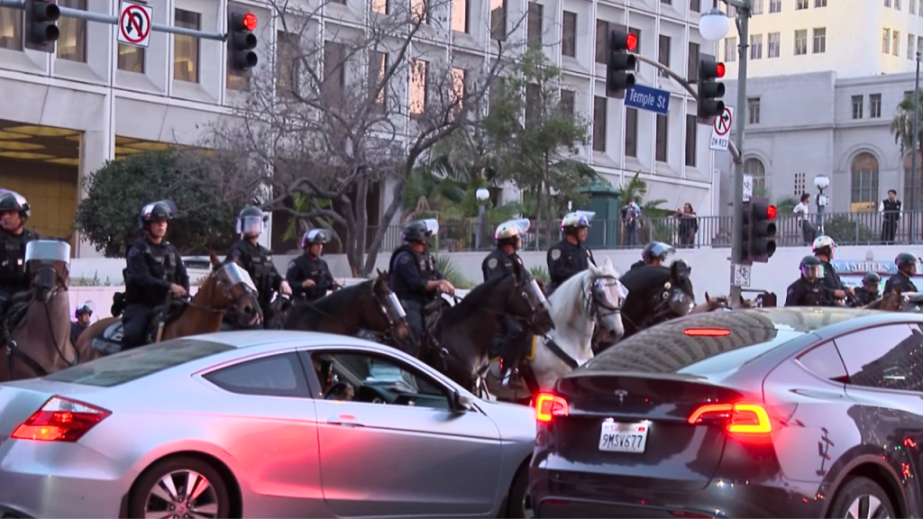 Map of Los Angeles highlighting overnight curfew zones under blue shading, with curfew hours noted along city boundary lines.