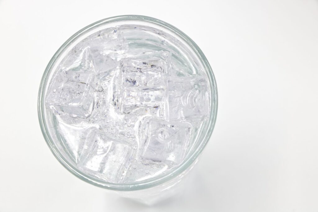 Close-up of a glass of ice water on a hot summer day