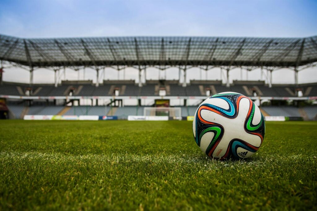 Soccer ball on green grass at a stadium ahead of World Cup 2026 watch parties